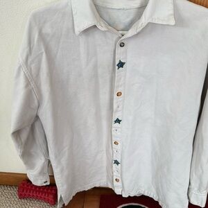 Women’s byrkit polo shirt cream in good condition
